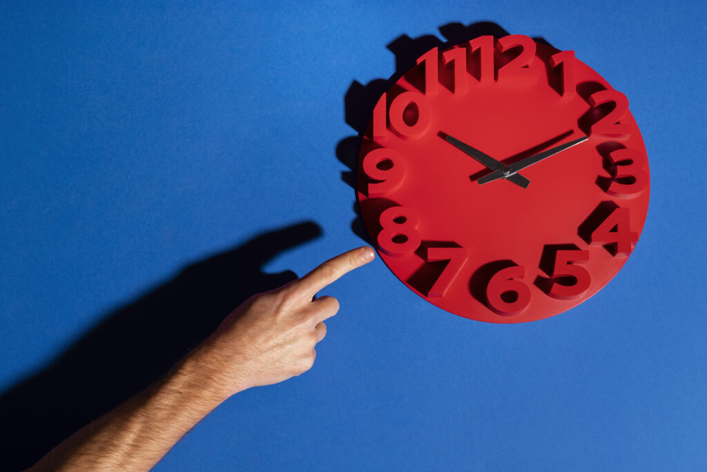 hand-holding-wall-clock