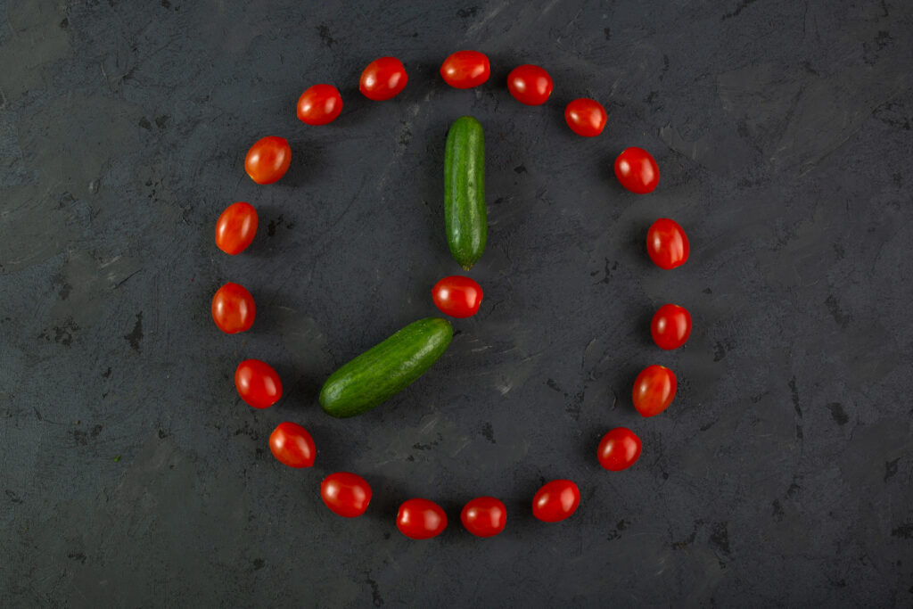 red-cherry-tomatoes-green-cucumbers-dark-background