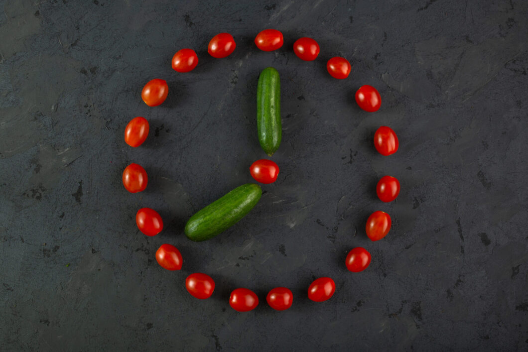 red-cherry-tomatoes-green-cucumbers-dark-background