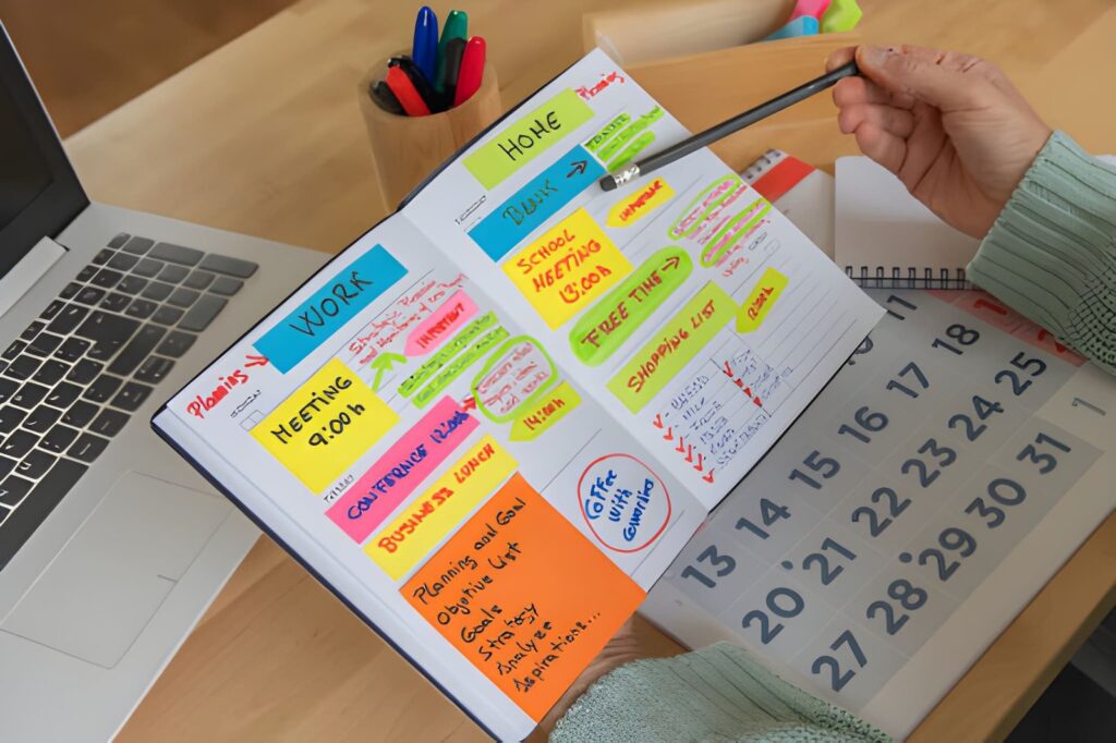 Professional Planner And Office Desk Setup With Laptop And Calendar