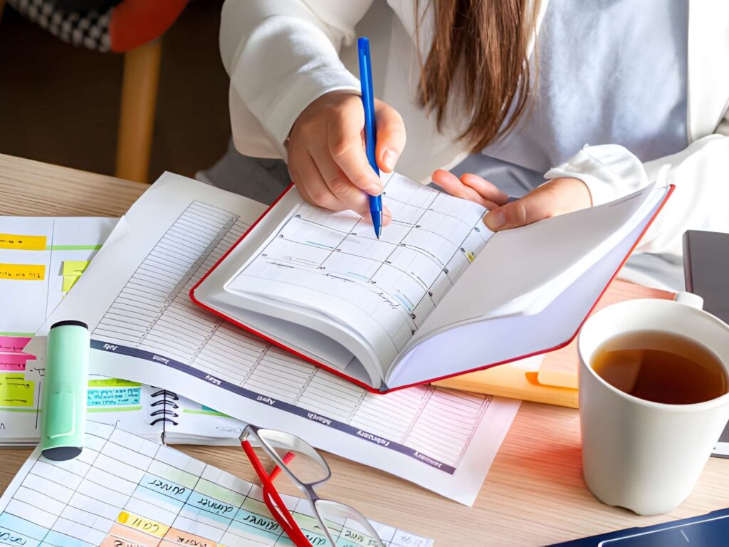 Woman writing on notebook