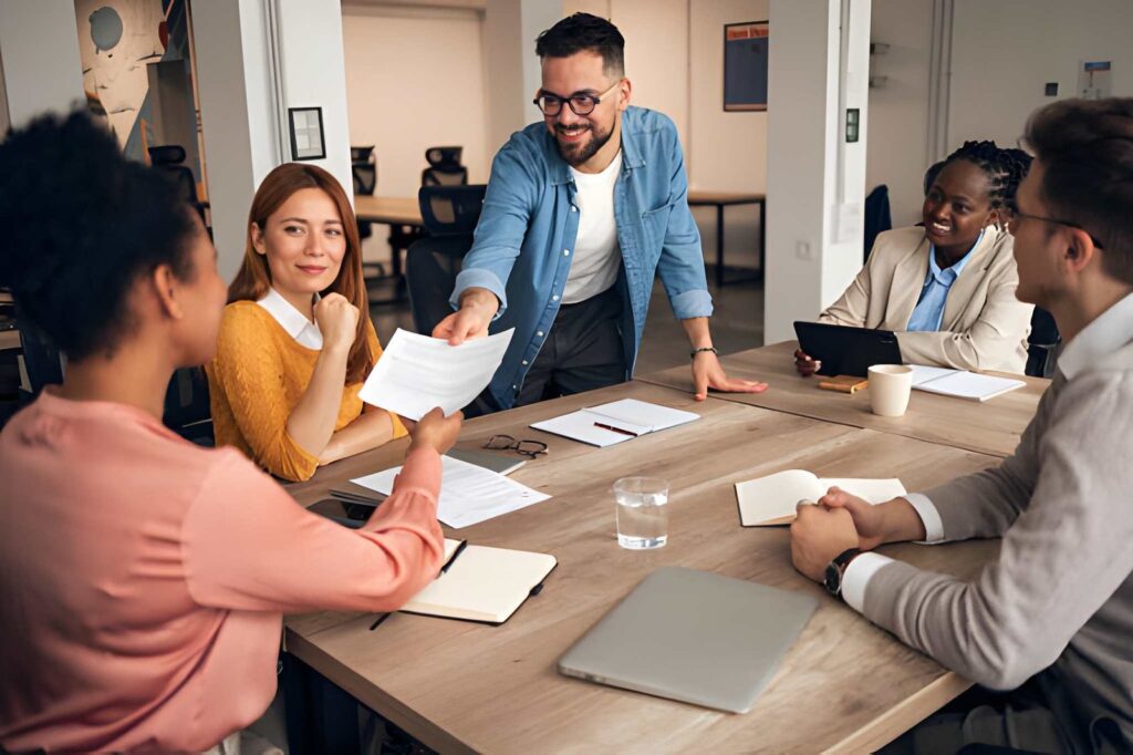 How (and What) to Delegate: 9 Practical Tips for Outsourcing 3 A man delegating tasks to a colleague