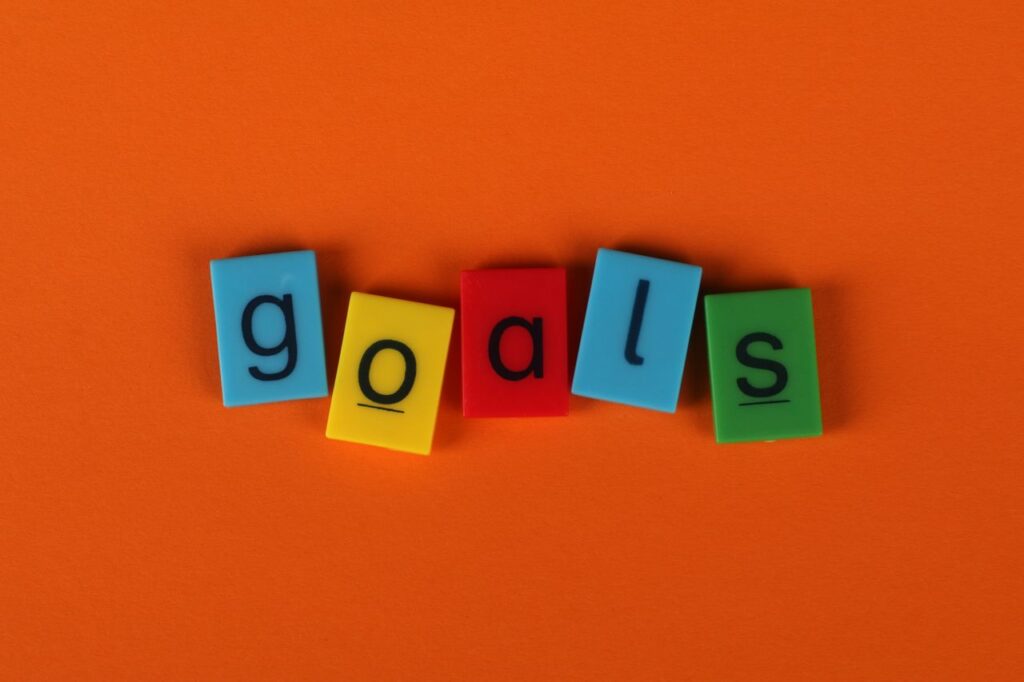 colorful-block-letters-spelling-goals-on-orange