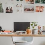 table-with-laptop-and-photo-camera