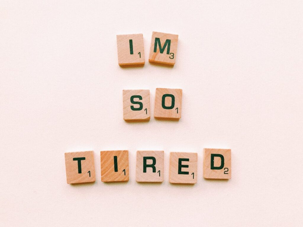 I'm so tired, brown wooden scrabble tiles