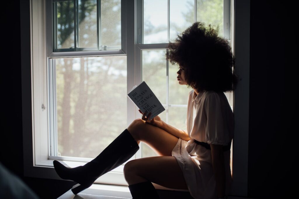 10 Practical Ways to Organize Your Life 2 woman-sitting-on-window-reading-book