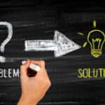 problem and solution written on a chalkboard