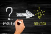 problem and solution written on a chalkboard